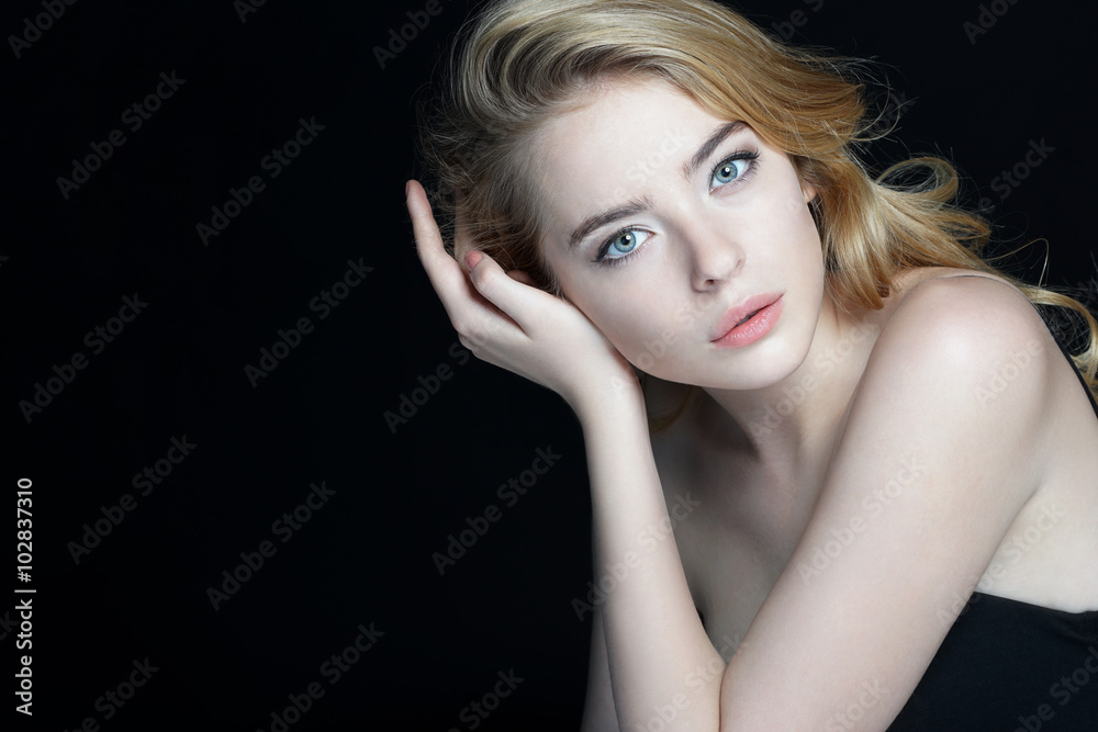 Gorgeous young model, youth and skin care concept. Close-up of an attractive girl of European appearance on dark background. Gorgeous young model, youth and skin care concept. Close-up of an attractive girl of European appearance on dark background.