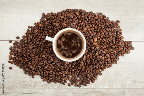 Fototapeta Naklejka Na Ścianę i Meble -  Cup of coffee in the coffee beans