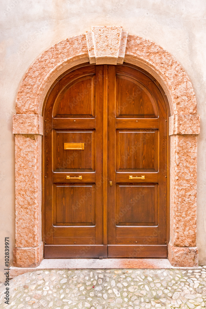 Entrance of an old apartment building in Malcesine, Italy.