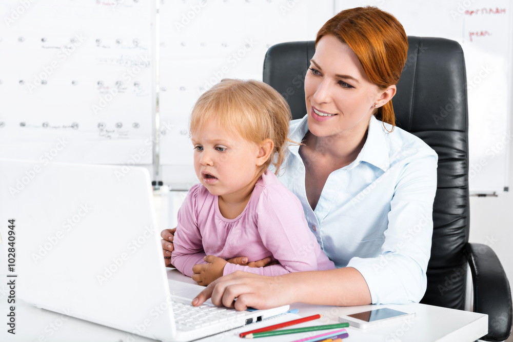 Business woman and daughter while working day Business woman and daughter while working day
