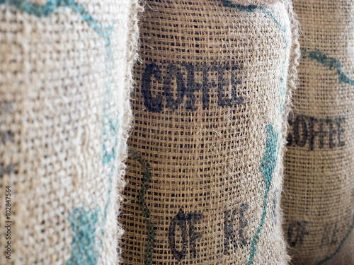 Close up of textured woven hessian fabric with the word Coffee s