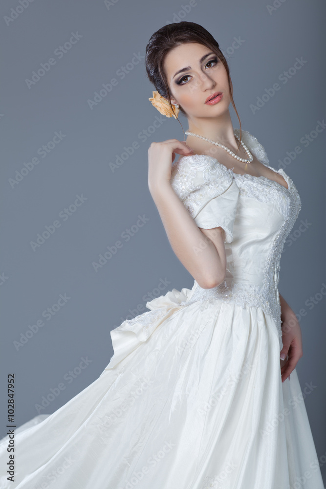 portrait of Beautiful bride in studio, gray background portrait of Beautiful bride in studio, gray background