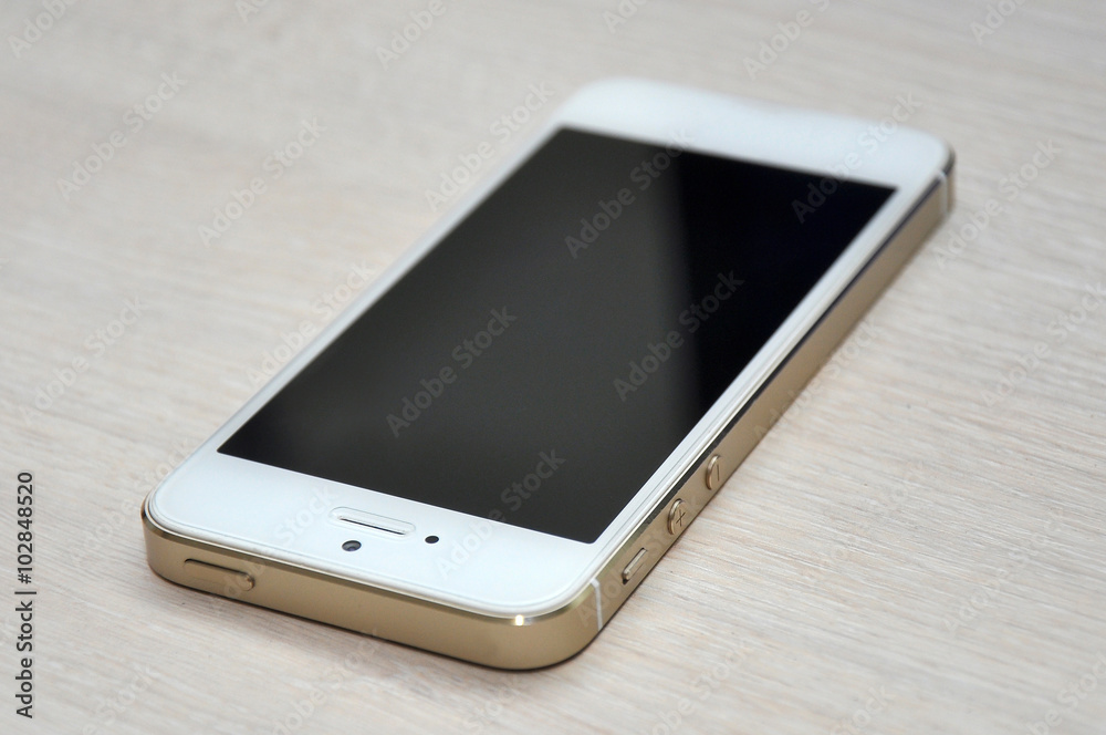 Blank screen mobile phone on wood background Blank screen mobile phone on wood background
