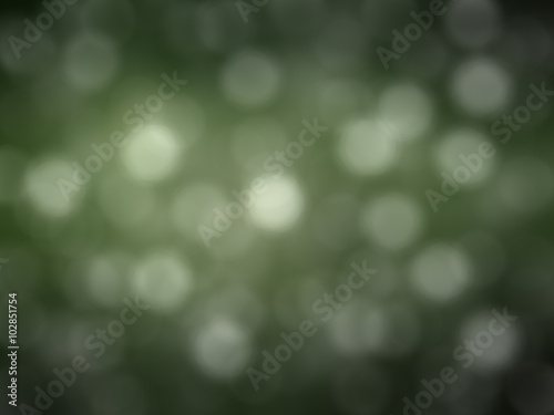 Bokeh light, shimmering blur spot lights on green abstract