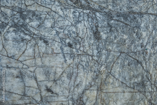 Cracked and weathered natural stone background
