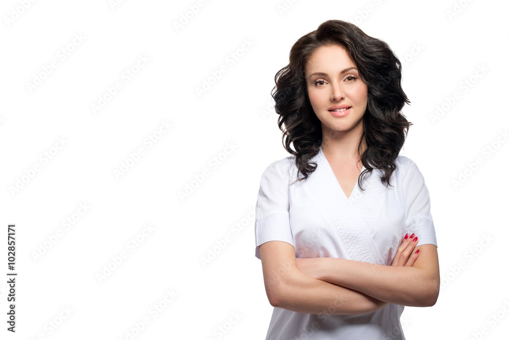 Young pretty female doctor in uniform keeping arms crossed and looking at camera isolated on white background. Young pretty female doctor in uniform keeping arms crossed and looking at camera isolated on white background.