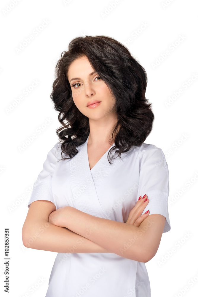 Young pretty female doctor in uniform keeping arms crossed and looking at camera isolated on white background. Young pretty female doctor in uniform keeping arms crossed and looking at camera isolated on white background.