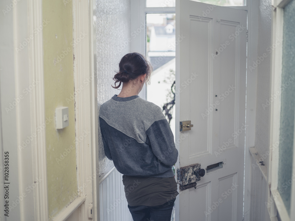 Young woman standing in doorway Young woman standing in doorway