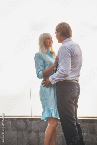 Beautiful embracing couple dressed in formal wear.