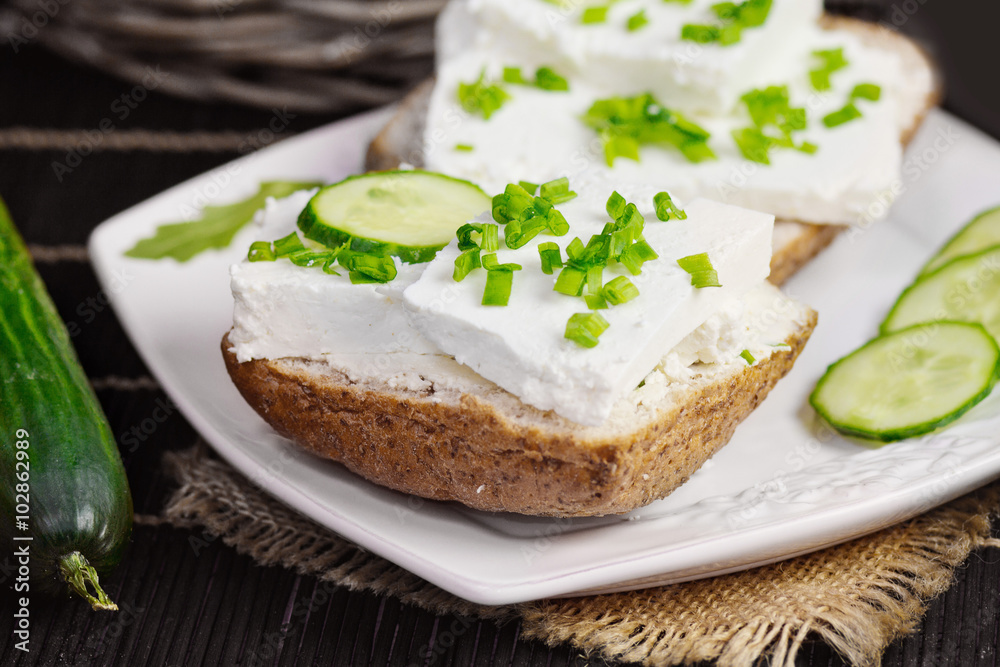 bread with curd cheese and chives.Shallow depth of field bread with curd cheese and chives.Shallow depth of field