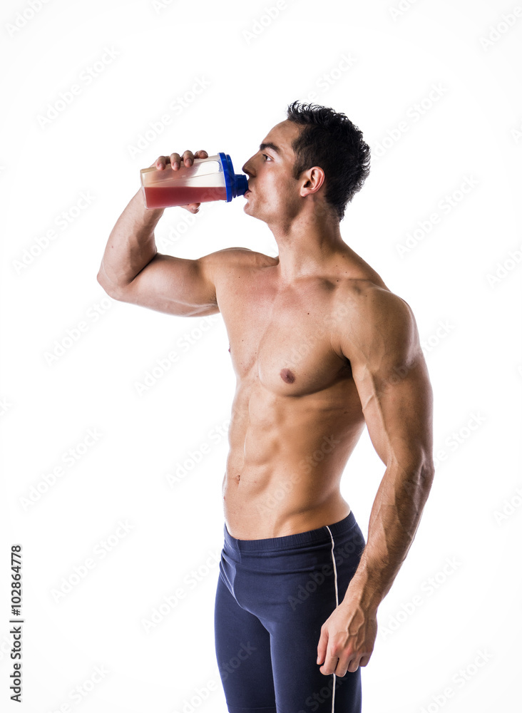 Muscular shirtless male bodybuilder drinking protein shake from blender  Stock Photo | Adobe Stock