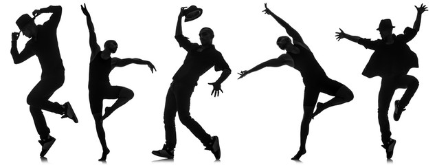 Silhouettes of dancers in dancing concept