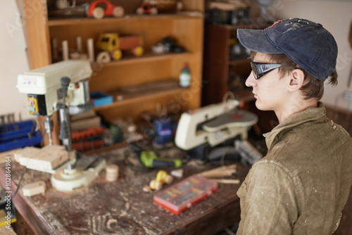 a workshop for the production of wooden products examines tools