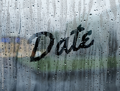 Date written on a foggy window photo