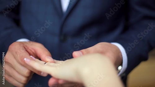 Two White People Groom and Bride Exchange Wedding Rings