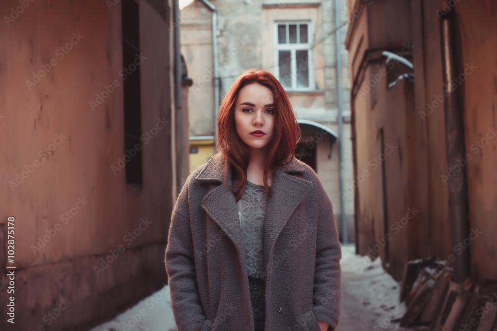 Pretty young woman in a coat