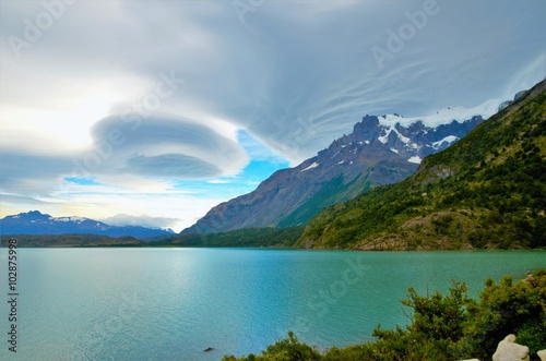 NORDERNSKJÖLD LAKE, TORRES DEL PAINE NATIONAL PARK, CHILE - FEBRUARY, 7, 2016: View over the Nordernskjöld lake, snow covered mountains in the background, stunning clouds