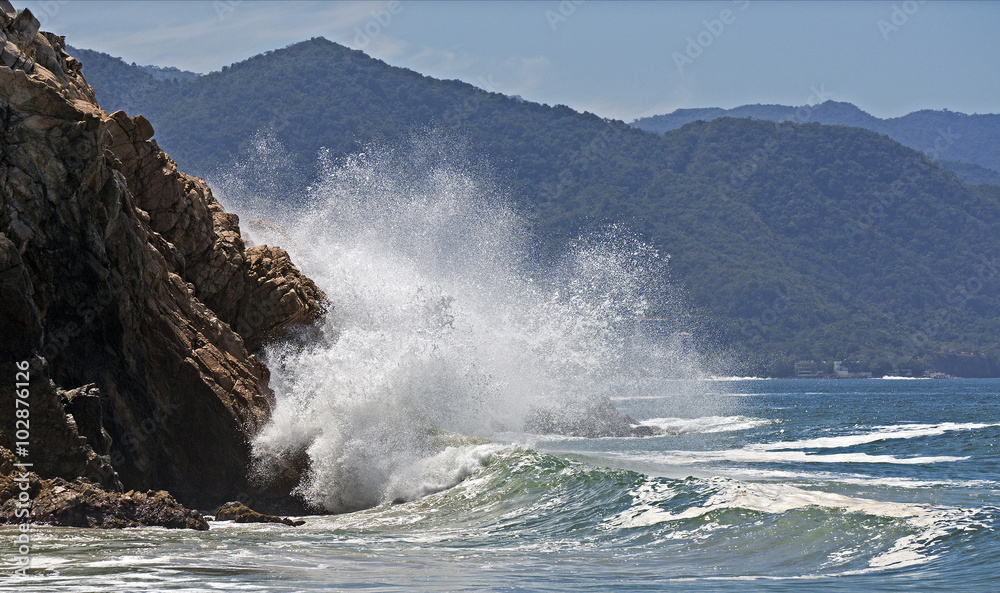 Waves crashing on a rocky coast.