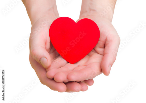 hands hold a red heart on white background