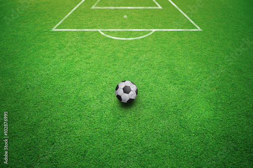 Conceptual football free kick soccer ball background. Soccer ball on sunny soccer field ground.  © robsonphoto