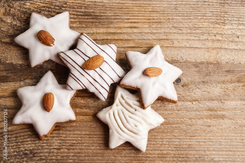 Gingerbread cookies in star shape decorated with almonds on brow