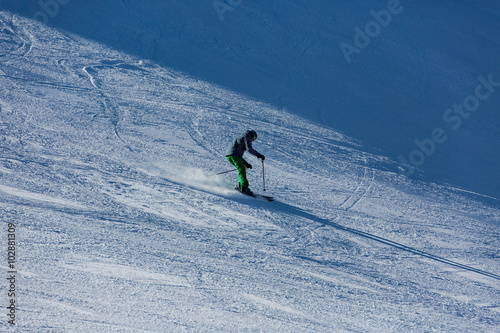 Skiers sliding from mountains