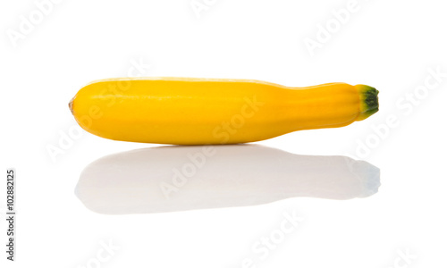 Fresh yellow zucchini over white background
