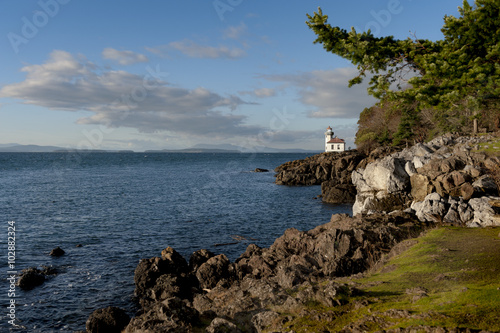 Line Kiln Lighthouse. Located on San Juan Island, in Washington state, It guides ships through the Haro Straits and is part of Lime Kiln Point State Park. It overlooks Dead Mans Bay. photo