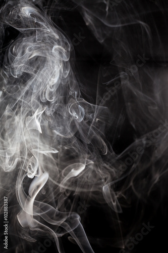 White smoke on a black background.