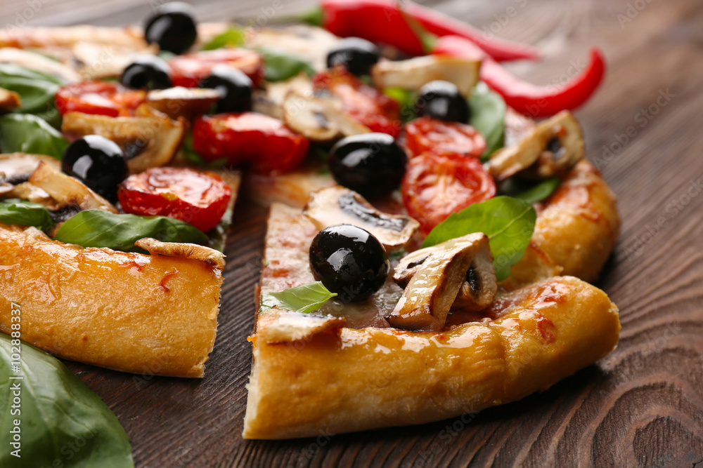 Sliced delicious tasty pizza, closeup Sliced delicious tasty pizza, closeup