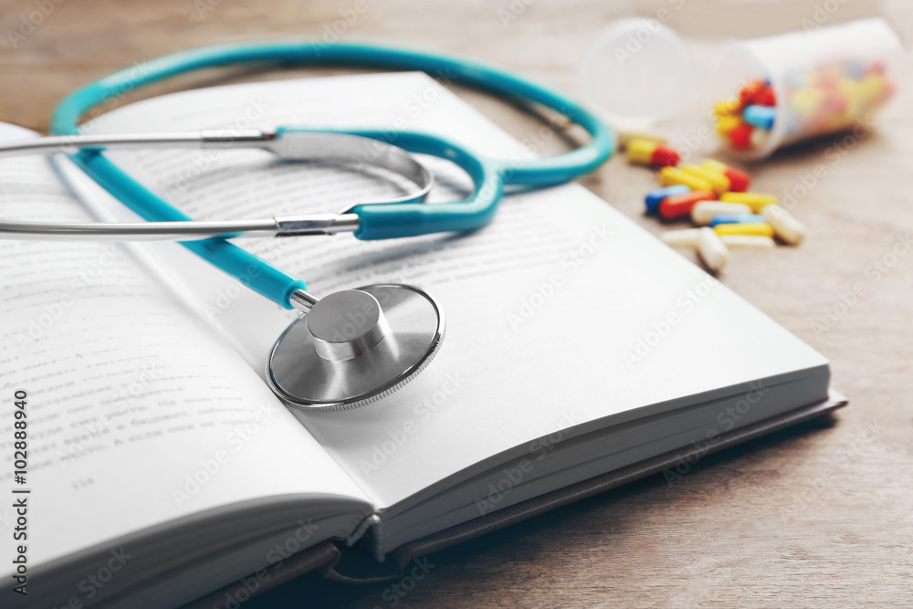 Stethoscope on a book, close up Stethoscope on a book, close up