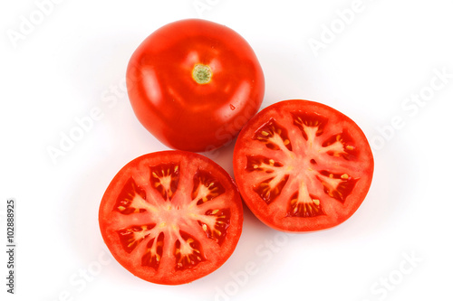 fresh whole tomato and half cut tomato on white background