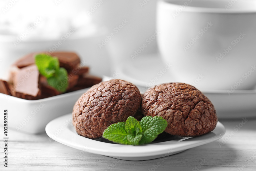 Chocolate chip cookie in plate with mint, closeup Chocolate chip cookie in plate with mint, closeup