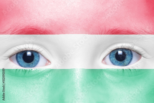 child's face with hungarian flag