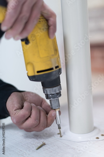 Wallpaper Mural repairman working with drilling machine Torontodigital.ca
