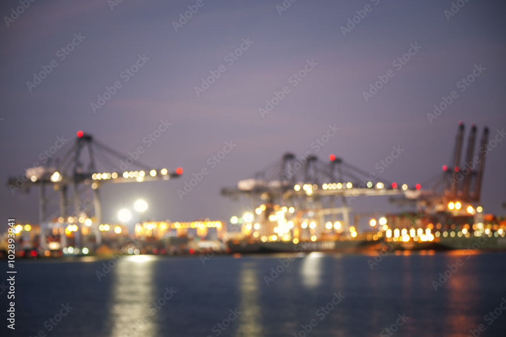 Blurred photo for Containers loading by crane in the sunset , Trade Port , Shipping