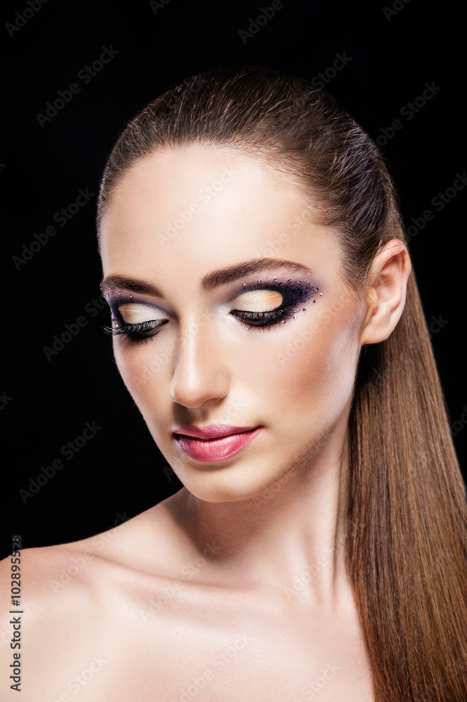 Girl in the studio on a black background make-up