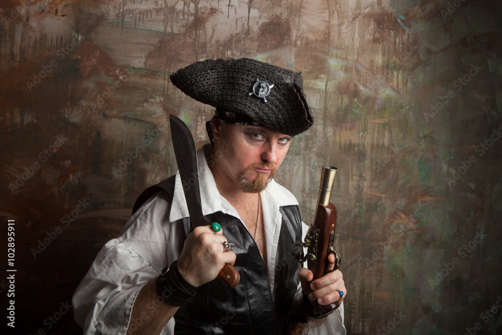 A man in a pirate costume with knife and gun