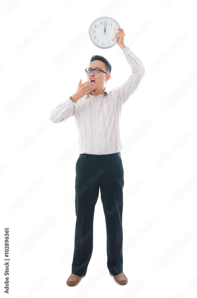 asian business man holding a clock concept photo asian business man holding a clock concept photo