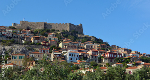  The popular holiday village of Molyvos village hillside and fort. © harlequin9