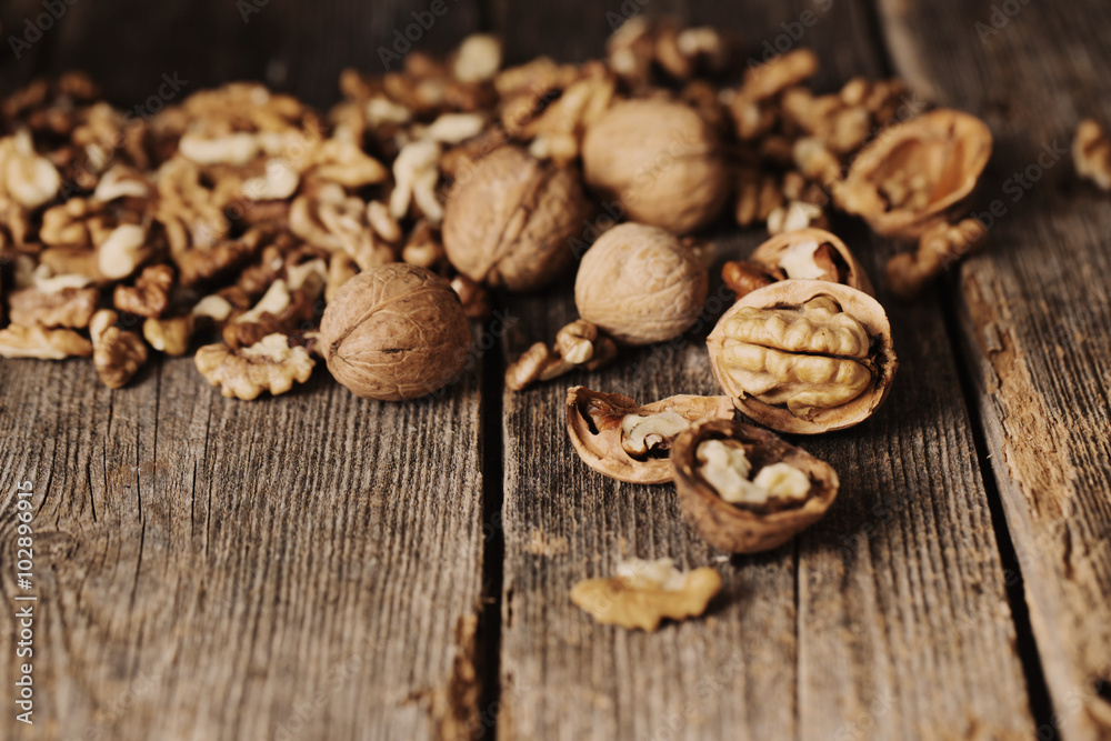 walnuts on rustic old wooden table walnuts on rustic old wooden table