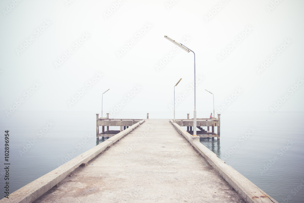 Vintage image of pier concrete bridge to the sea