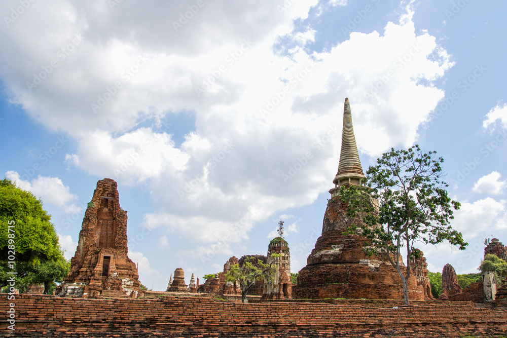 Tourist travel to visit ancient pagoda at Wat Mahathat temple, Ayutthaya, Thailand Tourist travel to visit ancient pagoda at Wat Mahathat temple, Ayutthaya, Thailand