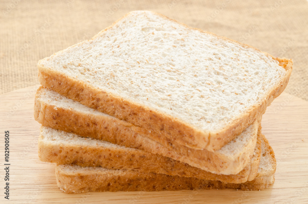 fresh bread wheat in the wooden board. fresh bread wheat in the wooden board.