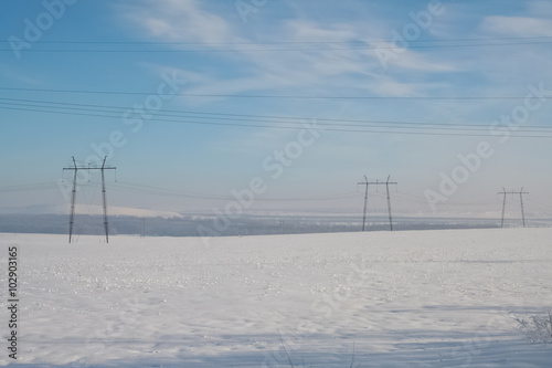 Power line on the winter field