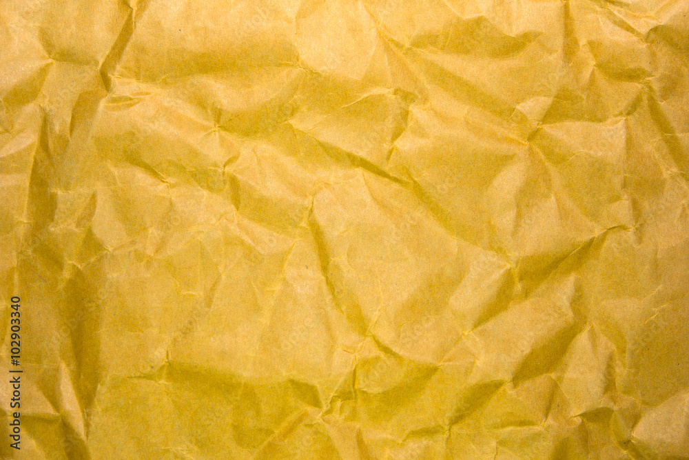 Yellow crumpled recycle paper background and texture