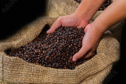 Coffee beans in hands