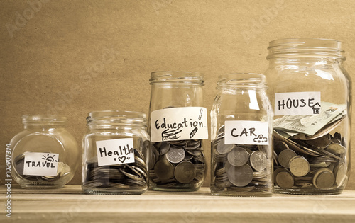 money saving in the glass bottle for money concept

