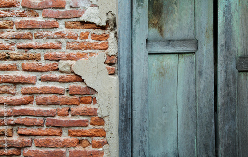 Half frame wooden blue door and brick wall 2