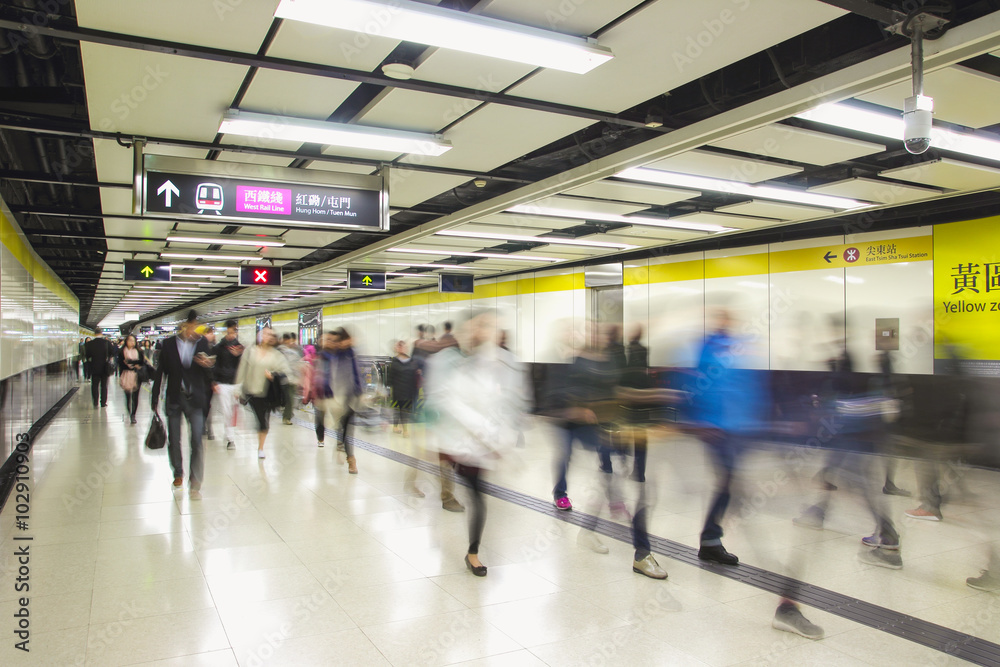 Crowd of passengers walk in Tsim Sha Tsui station on 7 Dec 2015. MTR is the main subway and train system in Hong Kong, and one of large transport networks in Asia Crowd of passengers walk in Tsim Sha Tsui station on 7 Dec 2015. MTR is the main subway and train system in Hong Kong, and one of large transport networks in Asia